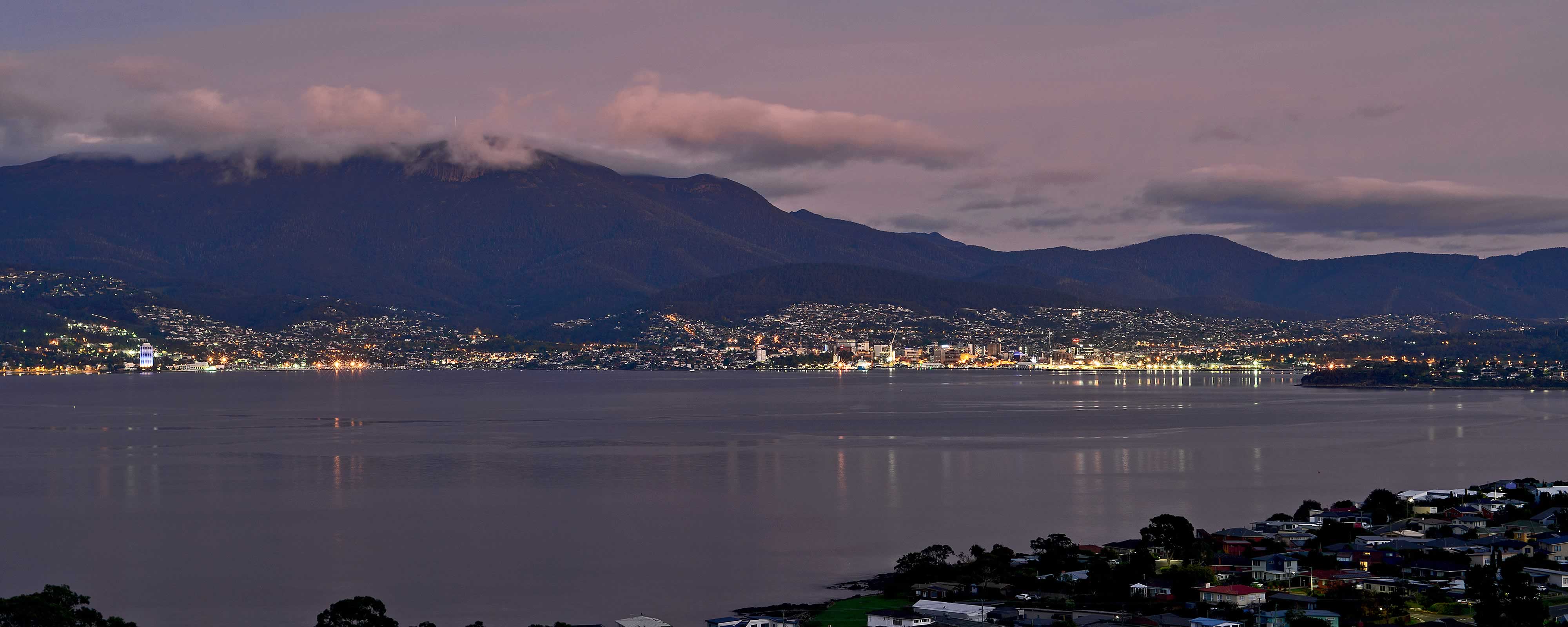 Night time view from Tunah Street looking across the River Derwent with clouds on kunanyi / Mount Wellington in the distance. Photo: Owen Fielding.